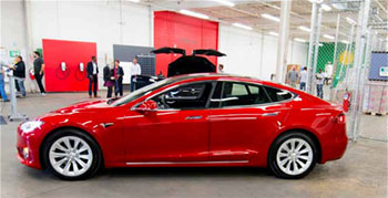 A red Tesla vehicle