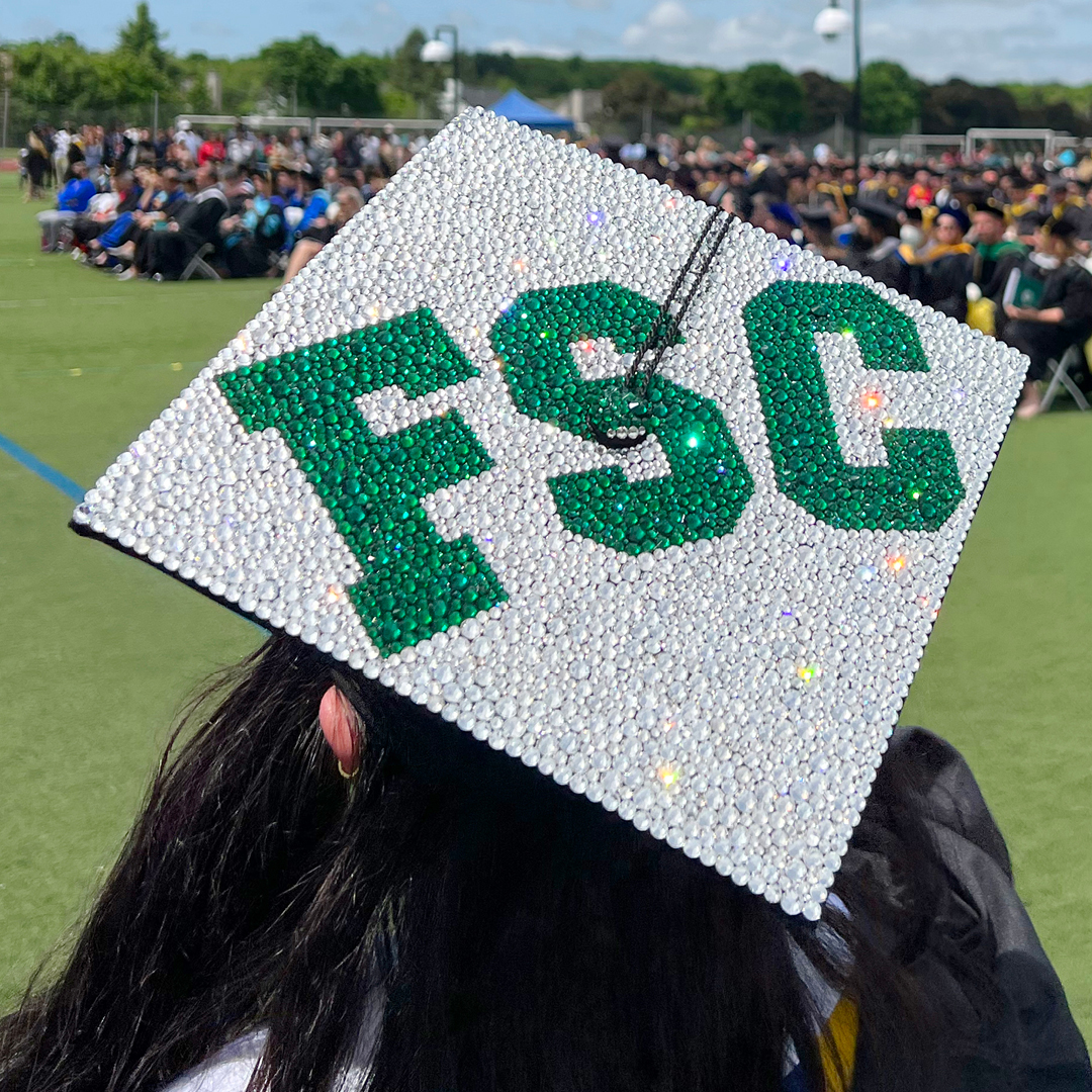 A graduation cap decorated with the FSC logo