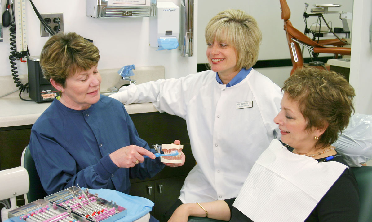 Dr. Laura Joseph working in the dental care unit of FSC.