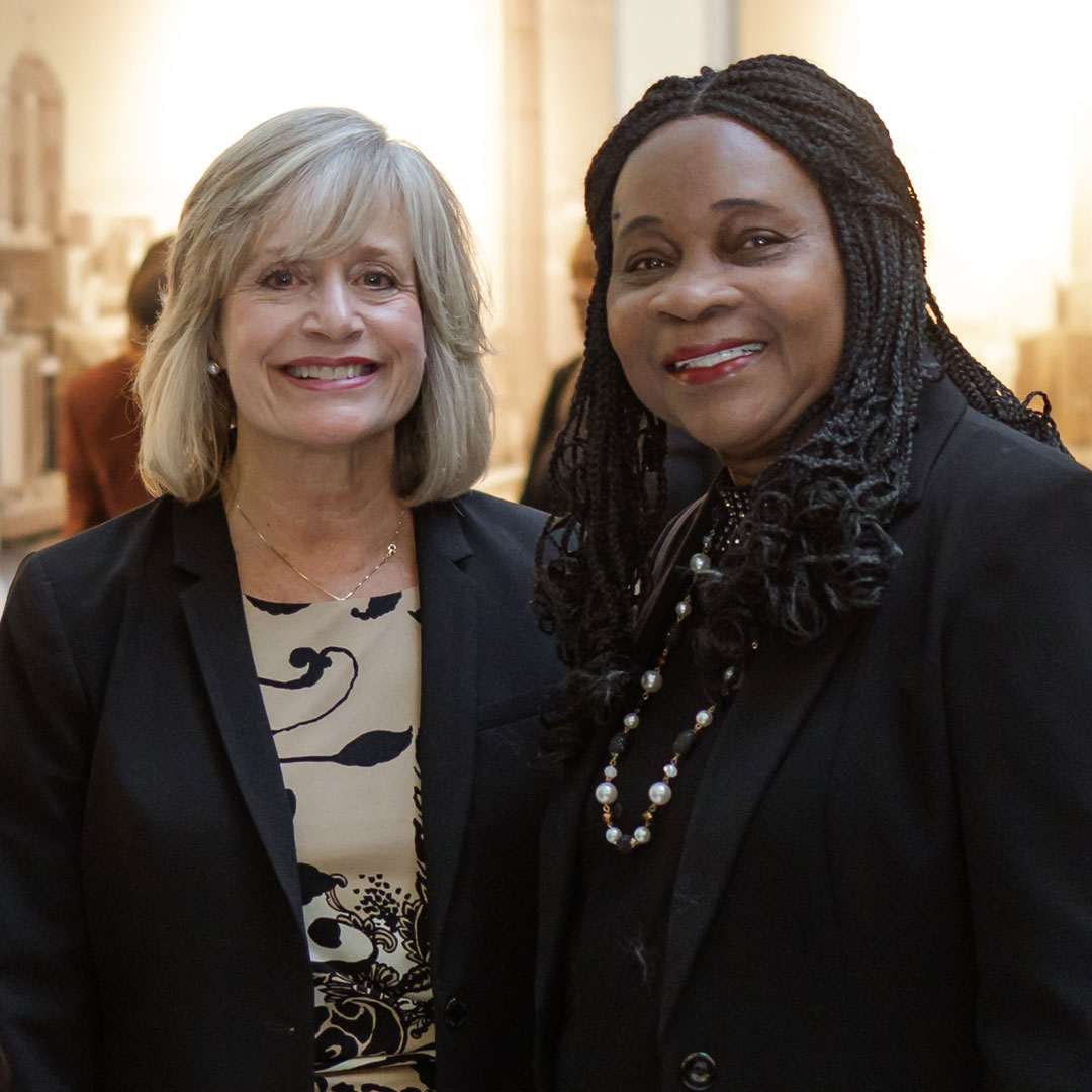 Dr. Laura Joseph with a staff member smiling at the camera