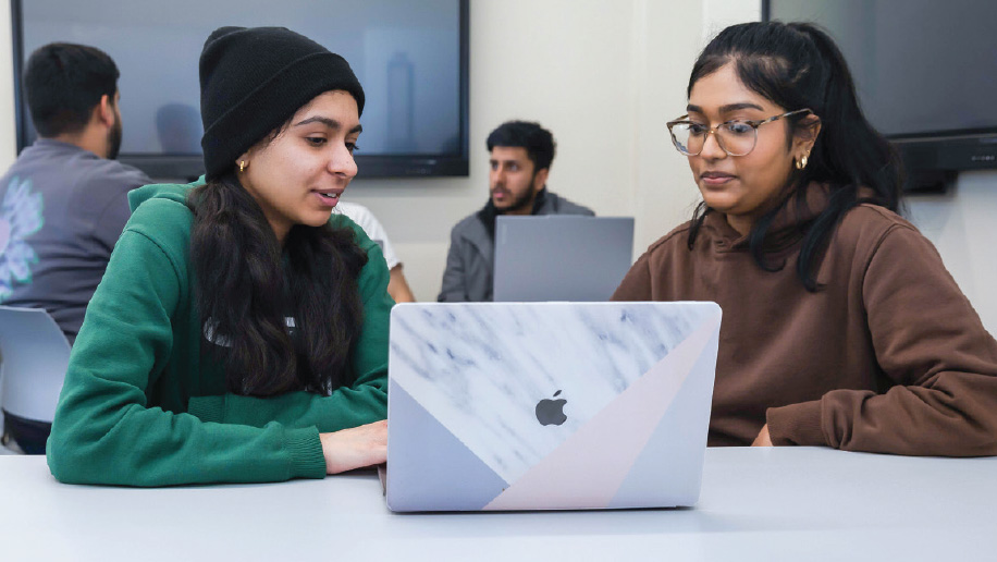 Students working on a laptop